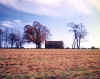 The Ray family house, seen from across the field.